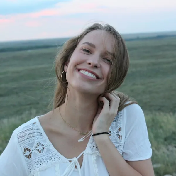 Smiling young woman outdoors