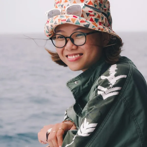 Visitor wearing glasses and a hat