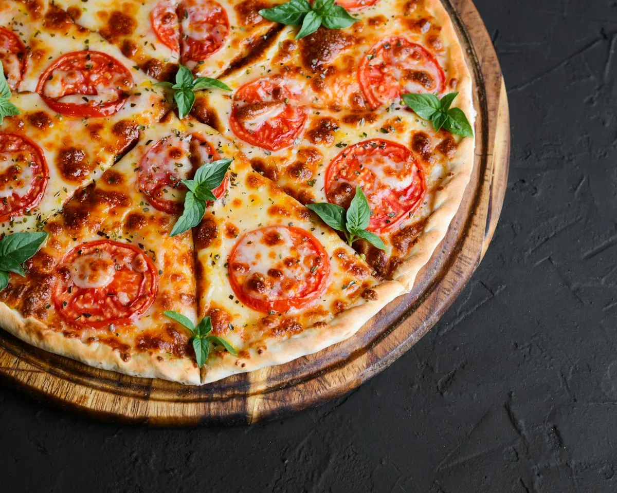 Sliced pizza topped with fresh vegetables